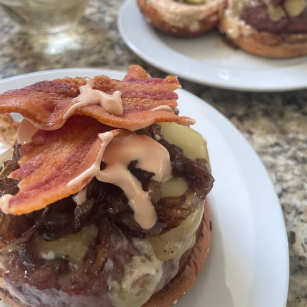 hamburger with bacon and melted swiss cheese